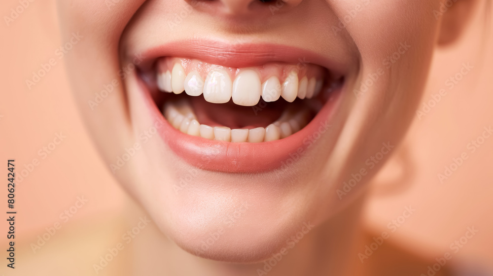 Bright, joyful smile showing healthy white teeth, set against a soft peach background. Bright, joyful smile showing healthy white teeth, set against a soft peach background.