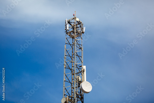 Telecoms masts on top of the mountain Puig de la Llorenca on a clear sunny day overlooking Cumbre Del Sol, Spain