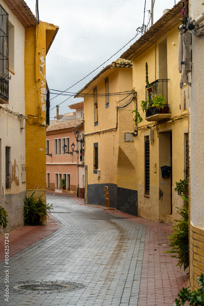 Beauticful street with colorful houses on a rainy day in Xilxes, Alicante, (Spain)