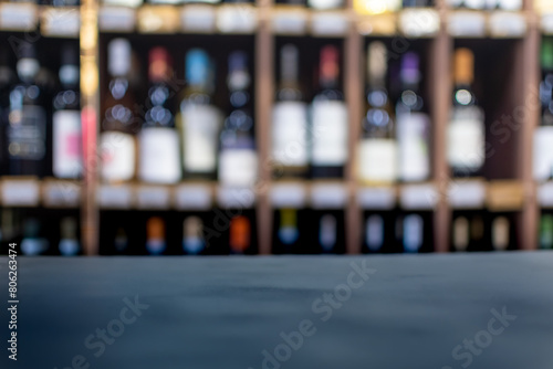 Blurred image of wine shelves with space for text