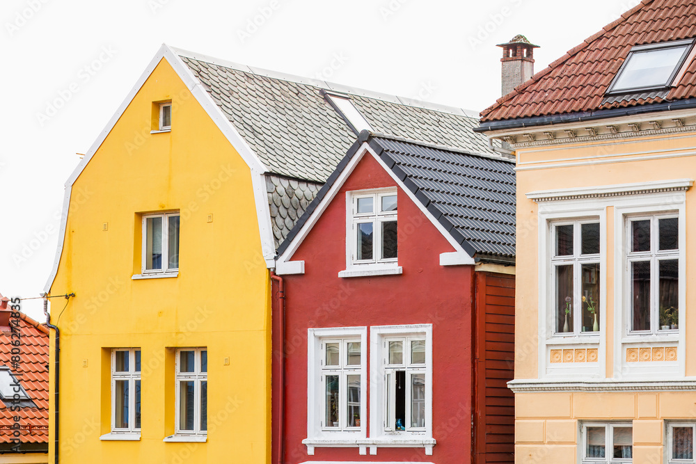 Colorful houses stand out in a row of traditional buildings in old city in Bergen, Norway. Colorful houses stand out in a row of traditional buildings in old city in Bergen, Norway.