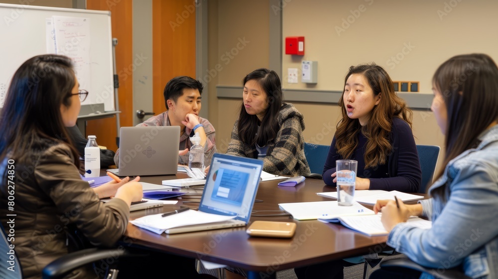 Group of people discussing in a meeting, great for themes of teamwork, education, and professional development. Group of people discussing in a meeting, great for themes of teamwork, education, and professional development.