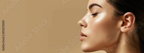 close up of a woman with clean fresh skin on a beige background, Beauty facial care. photo