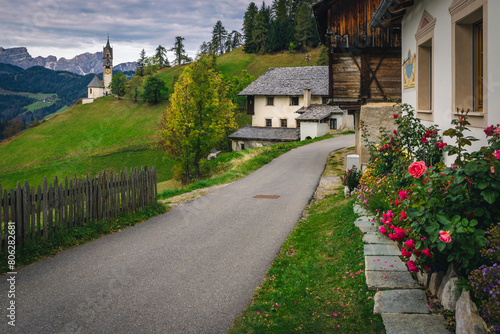 Street view with chapel of St Barbara in Dolomites, Italy