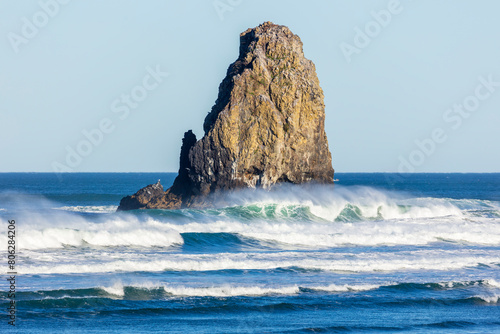 Waves crashing on the needles at Haystack in Cannon Beach Oregon