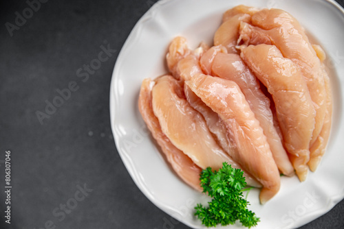 chicken meat raw aiguillettes fresh cooking meal food snack on the table copy space food background © Alesia Berlezova