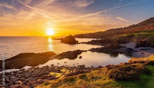 a breathtaking sunset over a rugged beach with the suns reflection shimmering on the water creating a stunning natural landscape at dusk
