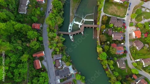 Luftaufnahme Kastenmuhlwehr in Weidach Weidachmuhle Wolfratshausen im Sommer. Aerial view of Isar River canal and dam. River crossing dam with pedestrian bridge in Wolfratshausen in Bavaria, Germany.  photo