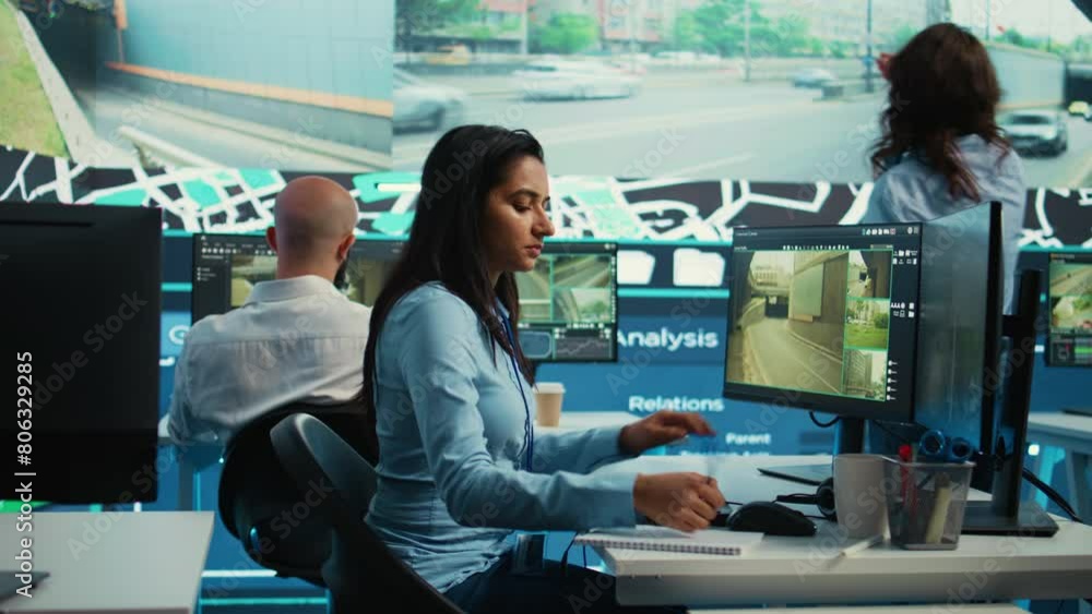 Indian employee collecting and transmitting information to couriers, locating the destination and sending the gps coordinates for faster order delivery. Dispatch call center operator. Camera B. Indian employee collecting and transmitting information to couriers, locating the destination and sending the gps coordinates for faster order delivery. Dispatch call center operator. Camera B.