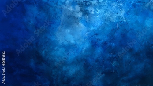 Abstract blue grunge background with dark and light areas of color