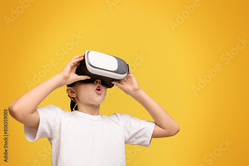A young child in awe while using a VR headset.