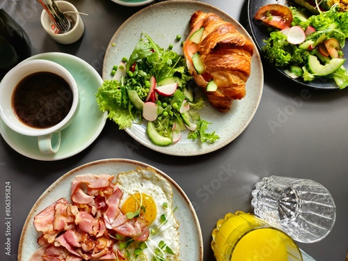 Breakfast Plates with Ham and Eggs Croissant on Plates and Coffee