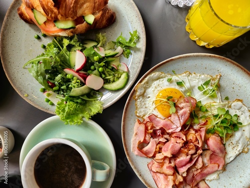 Breakfast Plates with Ham and Eggs Croissant on Plates and Coffee