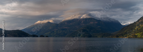 Harrison Lake located in the Fraser Valley of British Columbia with a dusting of snow in the higher elevations. This is a mountain in the Lillooet Ranges of southwestern British Columbia, Canada