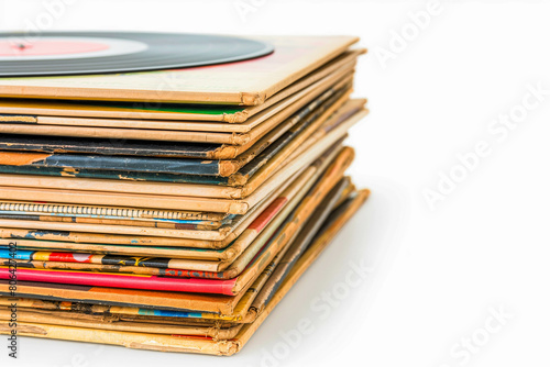 A stack of vintage vinyl records, each one a timeless classic, showcased against a clean white background.