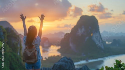 Mental Health concept: Happy girl raised hand on blurred mountain sunrise background. photo