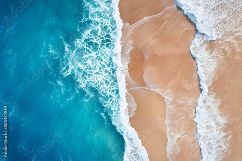 Sea and beach aerial view. Top view, amazing nature background. Beautiful beach of white sand surrounded by crystal clear water. Waves on the beach. Travel and vacation concept