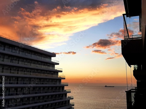 Sunset over the sea with a view of the buildings in the city of Santa marta, colombia