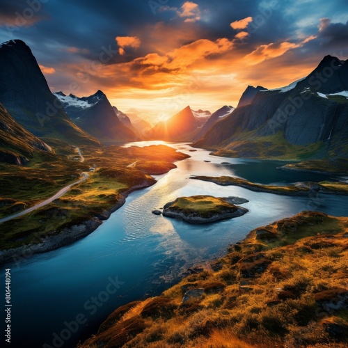 Majestic mountain landscape with glowing sunset over a serene lake