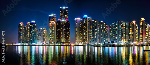 Busan Marina city skyscrapers illluminated in night © Dmitry Rukhlenko