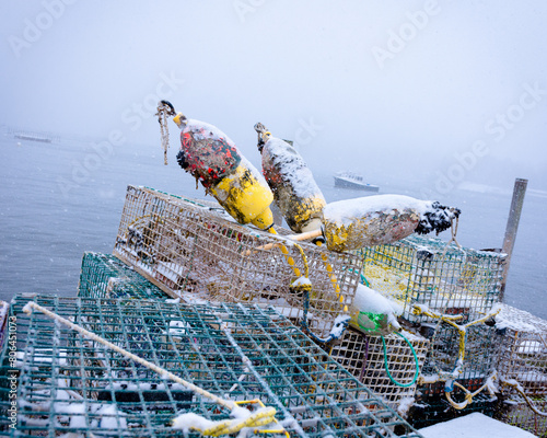 Lobster traps in snowstorm, New England coast photo