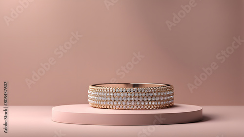 A gold and white bracelet is displayed on a pink background