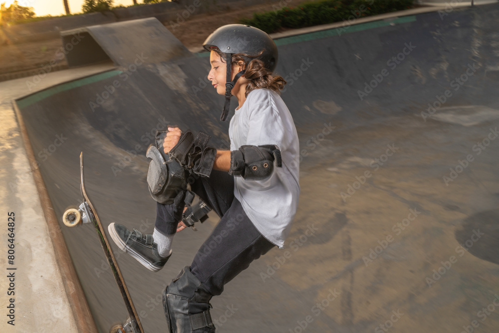 Boy riding his skateboard up the ramp Boy riding his skateboard up the ramp