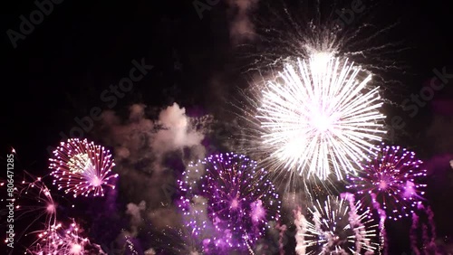 Purple Firework celebrate anniversary happy new year 2024, 4th of july holiday festival. Purple firework in night time celebrate national holiday. Violet firework Countdown to new year 2024 festival