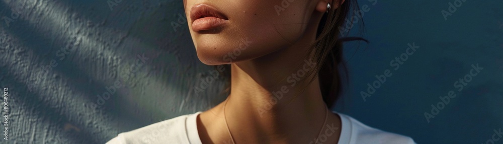 a close-up shot of the model's neckline and collarbone, highlighting the delicate femininity of the white t-shirt a close-up shot of the model's neckline and collarbone, highlighting the delicate femininity of the white t-shirt