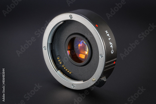 Teleconverter lens on a dark background