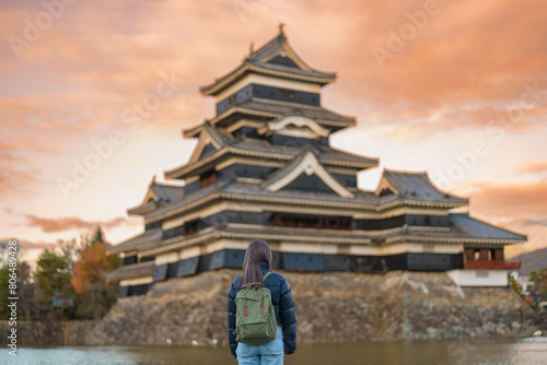 Woman tourist Visiting in Matsumoto  happy Traveler sightseeing Matsumoto Castle or Crow castle. Landmark and popular for tourists attraction in Matsumoto  Nagano  Japan. Travel and Vacation concept