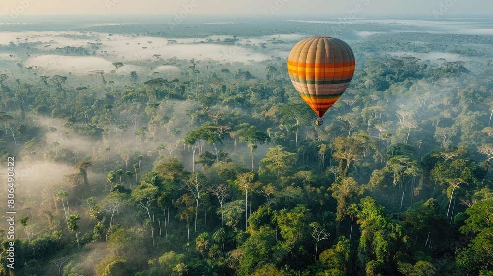Fototapeta premium Hot air balloon floating over amazon forest with copy space area.