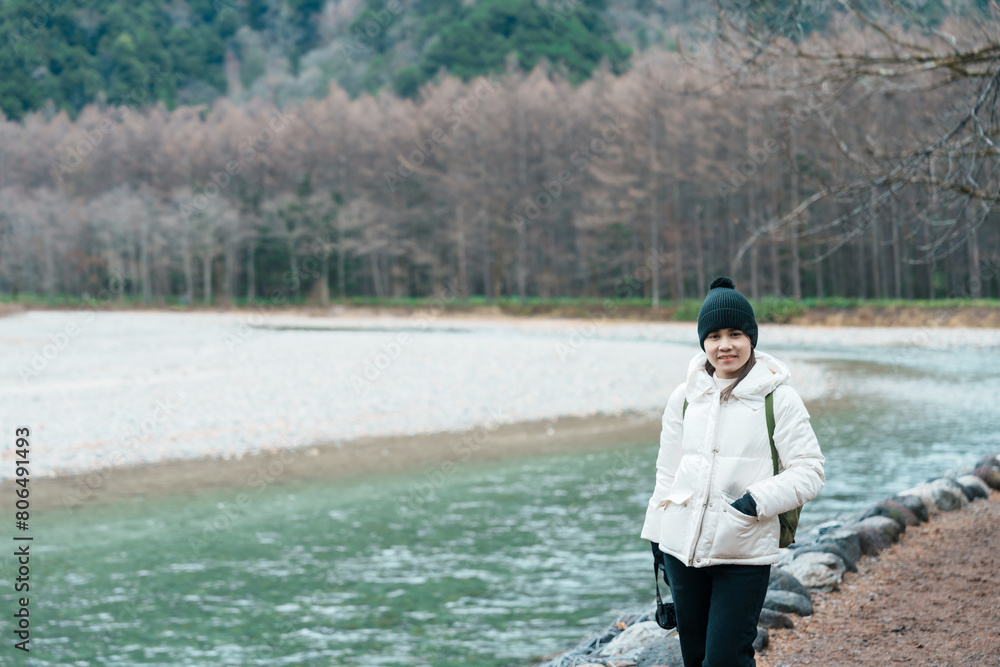 Woman tourist travel Kamikochi National Park, happy Traveler sightseeing Azusa river with mountain, Nagano Prefecture, Japan. Landmark for tourists attraction. Japan Travel, Destination and Vacation Woman tourist travel Kamikochi National Park, happy Traveler sightseeing Azusa river with mountain, Nagano Prefecture, Japan. Landmark for tourists attraction. Japan Travel, Destination and Vacation
