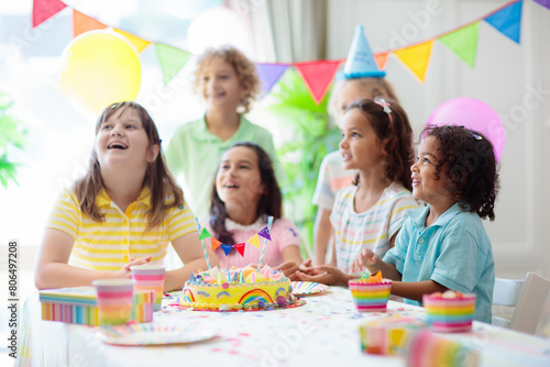 Kids birthday party. Children with cake and gifts