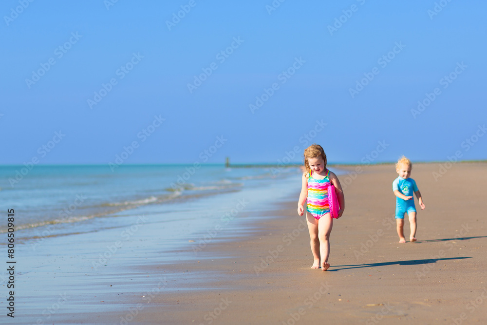 Kids playing on beach. Children play at sea. Kids playing on beach. Children play at sea.