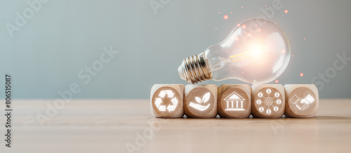 Fotografija ESG, Environment social governance investment business concept, Wooden block and light bulb on desk with environment social governance icon on virtual screen