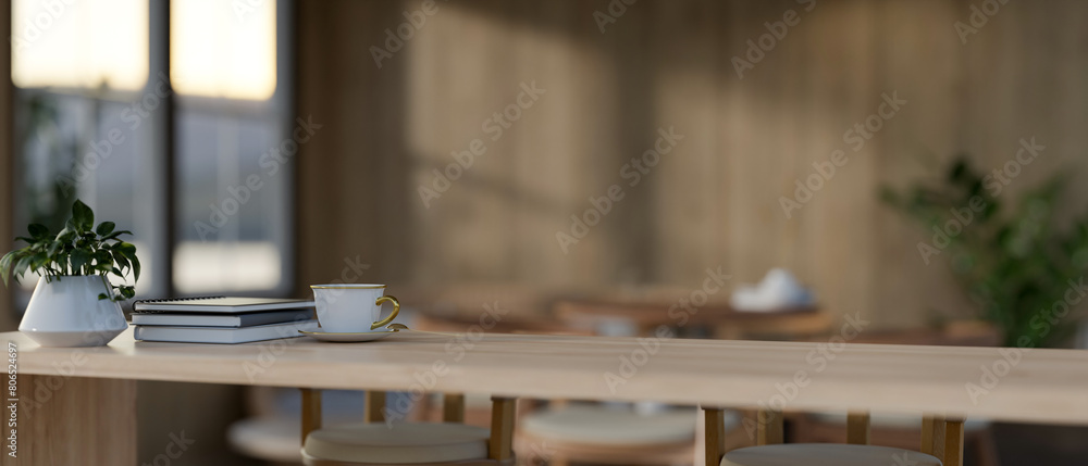 A display space on a wooden table showcases products in a cozy wood room. A display space on a wooden table showcases products in a cozy wood room.