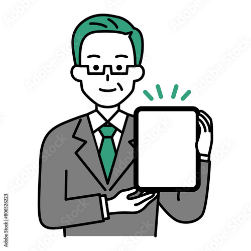 タブレットを持っている年配のスーツの男性