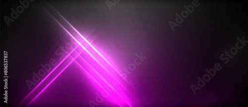 A vibrant purple light illuminates a dark black background, creating a striking contrast. The intensity of the magenta hue creates an electric, neon effect