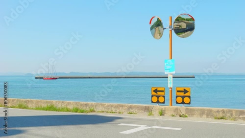 Dramatic view of a traffic mirror by the beach in summer, Teshima Island in Kagawa Prefecture in Japan, Travel or outdoor photo