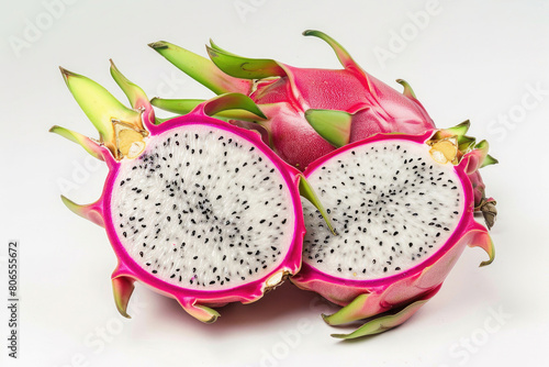 An exotic dragon fruit with a vibrant pink exterior and white flesh