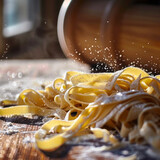 close up of fresh handmade pasta on table with flour dusting