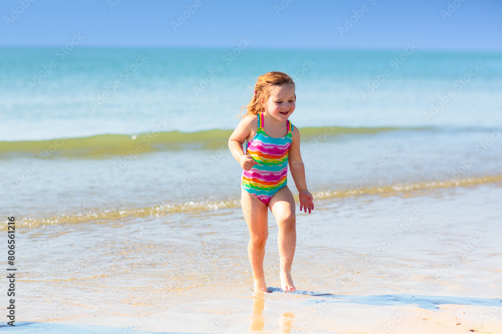 Kids playing on beach. Children play at sea.