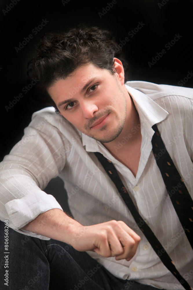 Obraz premium studio portrait of a confident smiling young man 