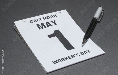 May 1st calendar sheet. Labor Day or Worker's day on the table  photo
