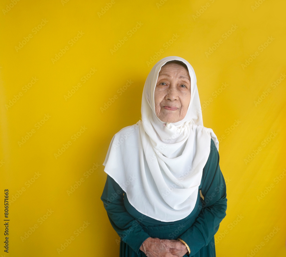 Portrait Of Elderly Asian Muslim Woman Looking At Camera Smiling Portrait Of Elderly Asian Muslim Woman Looking At Camera Smiling