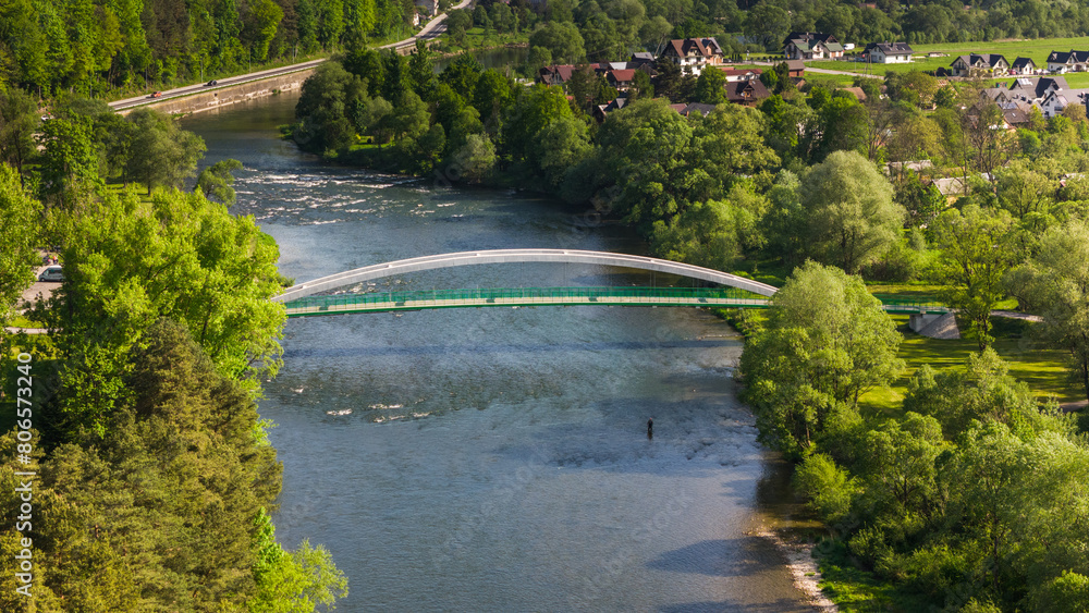 Fototapeta premium Szczawnica townscape and Dunajec River bends. Aerial drone view at springtime