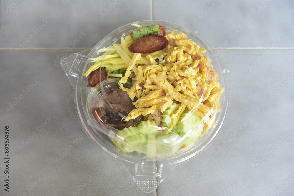 Rice mixed with mango shrimp paste in a plastic box Rice mixed with mango shrimp paste in a plastic box