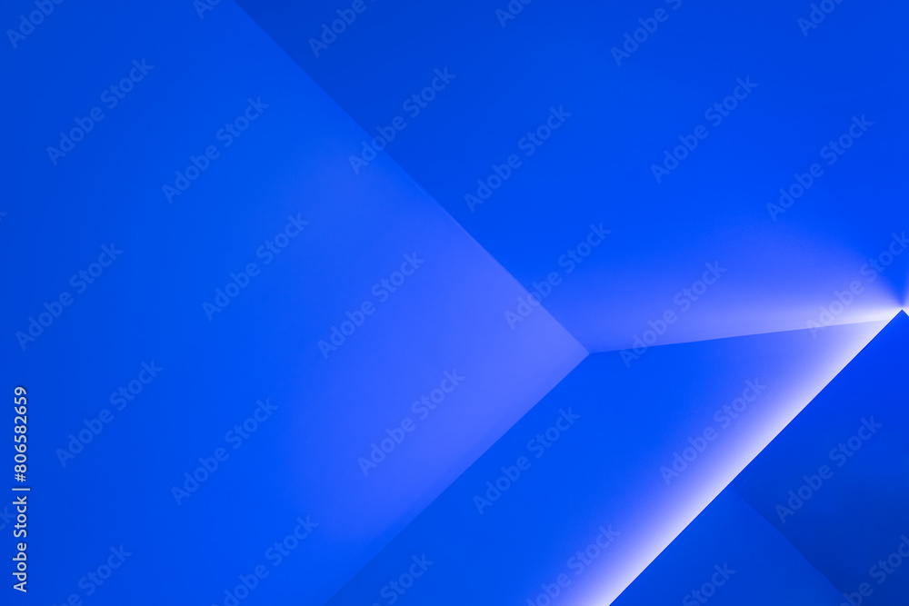 Modern interior walls, backgrounds, studio and product display backdrops. There are shadows from blue and white. Background for text insertion and product presentation