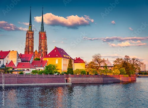 Colorful spring view of Tumski island with two spire of cathedral of St. John on Odra river. Spectacular morning cityscape of Wroclaw, Poland, Europe. Traveling concept background.